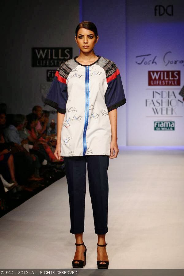 A model walks the ramp for fashion designer Josh Goraya on Day 5 of Wills Lifestyle India Fashion Week (WIFW) Spring/Summer 2014, held in Delhi.