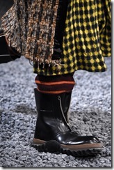 MILAN, ITALY - JANUARY 13:  A model, detail, walks the runway at the Marni show during Milan Men's Fashion Week Fall/Winter 2018/19 on January 13, 2018 in Milan, Italy.  (Photo by Pietro D'Aprano/Getty Images for Marni)