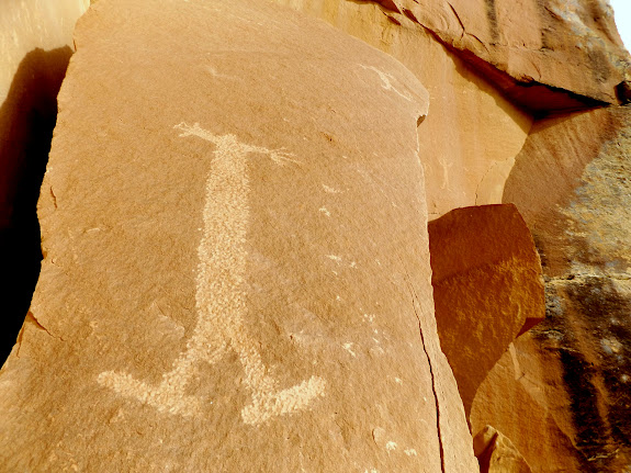 Three figures with elongated bodies