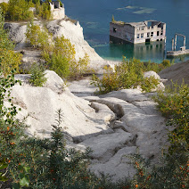 Rummu is an unusual place in Estonia where you can find an abandoned prison and quarry with submerged walls, gates and buildings. Very surreal! Surreal Rummu photos