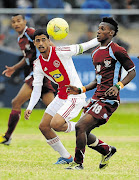 TOP PROSPECT: Abbubaker Mobara of Ajax Cape Town, left, challenges Wanyou Obou of Berea Albion during a Metropolitan Premier cup final match