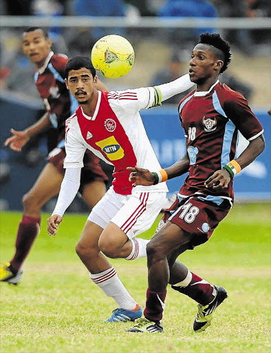 TOP PROSPECT: Abbubaker Mobara of Ajax Cape Town, left, challenges Wanyou Obou of Berea Albion during a Metropolitan Premier cup final match