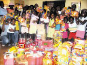 HAPPINESS: Emthonjeni Pathfinders with the goodies from Mama jAngel, Glenryck and Vicky's Catering. © Sowetan.