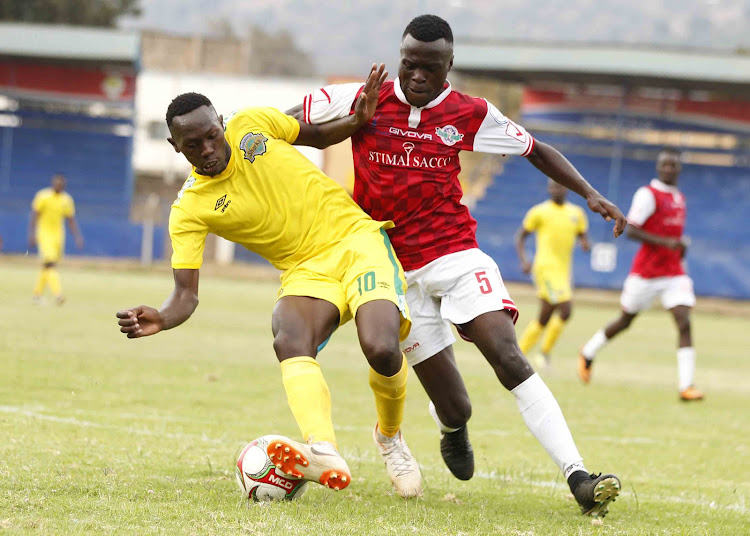 Sharks' Duke Abuya (L) in action with Kelvin Wesonga of Western Stima