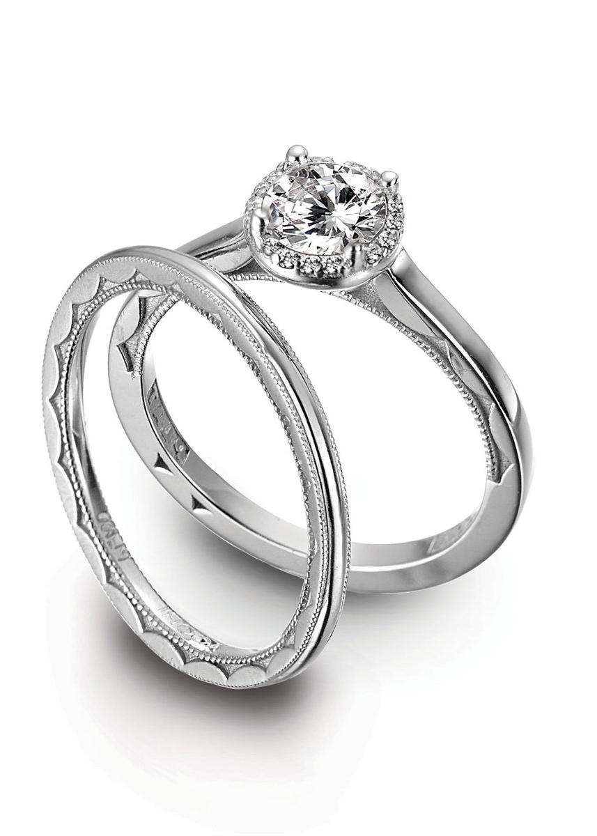 halo for diamonds and hand-engraved wedding band with cresent detail.