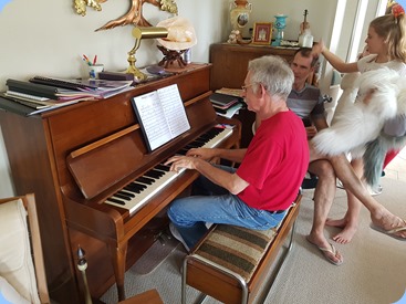 Claude Moffat palying the Hoffman upright grand piano.