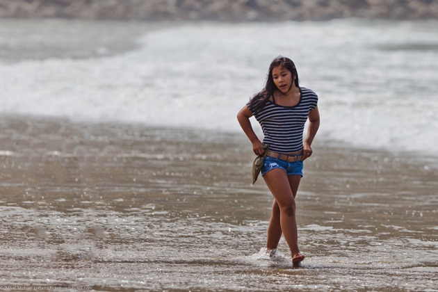 Brother and older sister walking in the surf on Morro Strand State Beach Near Morro Rock, Morro Bay, CA,  Sunday, 04 September 2011.