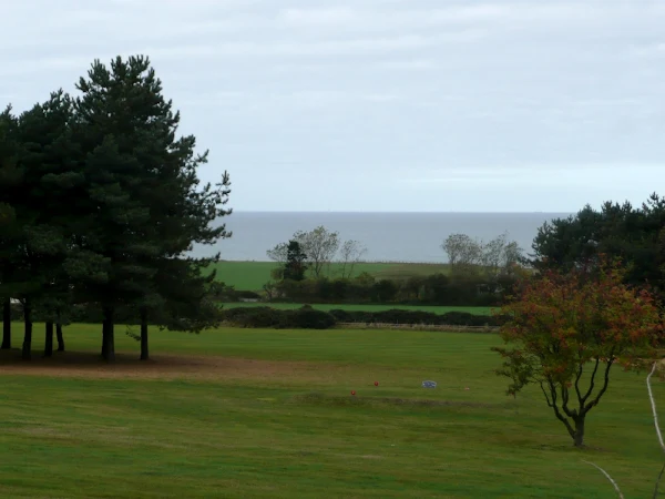 Looking down to the sea across the golf course