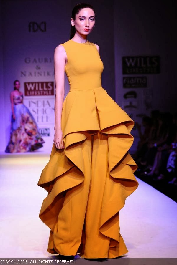 Kanika showcases a creation by fashion designers Gauri and Nainika on Day 1 of Wills Lifestyle India Fashion Week (WIFW) Spring/Summer 2014, held in Delhi.