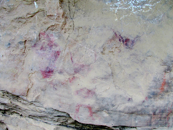 Three very weathered pictograph figures