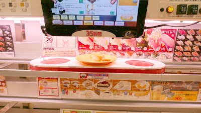 Genki Sushi in Shubuya, where you order from individual screens as you seat from a menu (there is an English menu available) and then the dishes come essentially via a sushi train directly to you. You can order 3 at at time since that's what the train holds, but usually stuff comes one plate at a time as soon as it's ready