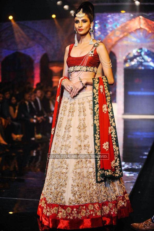 A model walks the ramp for Bridhichand Ghanshyamdas Jewellers on Day 3 of India International Jewellery Week (IIJW), 2014, held at Grand Hyatt, in Mumbai.<br /> <br /> <br /> 