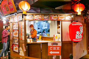 Namja Town has an area that is their Gyoza Stadium with a dozen little booths of different pot stickers, or gyoza, to try. You can get them for here or to go in little boxes you can collect in a basket so you can sample from multiple booths and try different styles