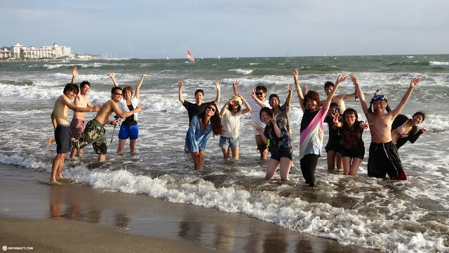 locals enjoying the Pacific ocean at Yuigahama Beach in Kamakura, Japan in Kamakura, Japan 