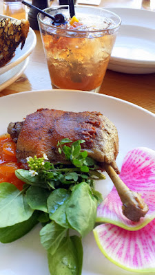 Happy Hour and Dinner only starter at Nel Centro of Duck Leg Confit with Kumquat Gastrique along with the Ol' Man River cocktail with Burnside Bourbon, Calisaya, and bitters, inspired by the Portland Opera’s 2015 run of Show Boat.