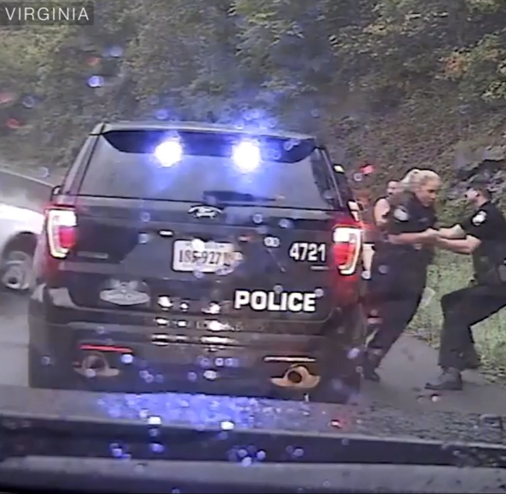 Touching Moment police officer pulled his colleague out of harm's way before an accident (video)