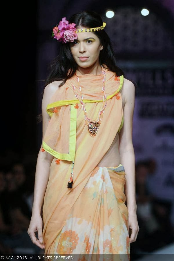 Sucheta Sharma showcases a creation by fashion designer Anupama Dayal on Day 1 of Wills Lifestyle India Fashion Week (WIFW) Spring/Summer 2014, held in Delhi.