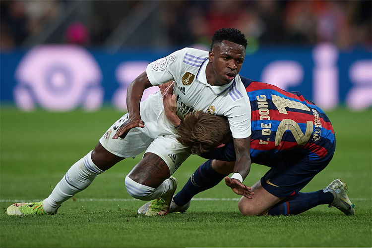 Real Madrid Vinicius Jr. (L) Frankie de Jong of Barcelona tumble during a Copa del Rey semifinal first leg match on March 2