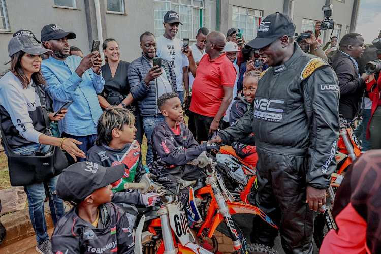 Deputy President Rigathi Gachagua interacting with children during the opening of the Talanta Motorsport Academy at the Kenya Academy of Sports at Kasarani Stadium, Nairobi on March 27, 2027.