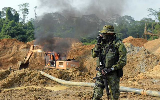 Brazil Federal police set fire to illegal heavy gold mining equipment, 5 May 2018. The indigenous Munduruku say that the police have done little to protect their preserve on the Tropas River. Photo: Federal Police of Santarem