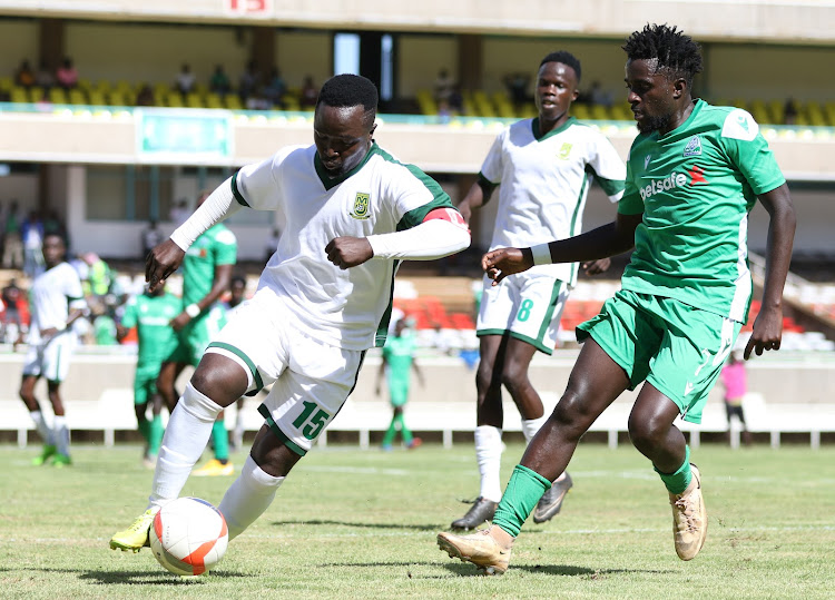 Mathare United's Danson Kago (L) takes on Austin Odhiambo of Gor Mahia during a past Premier League match