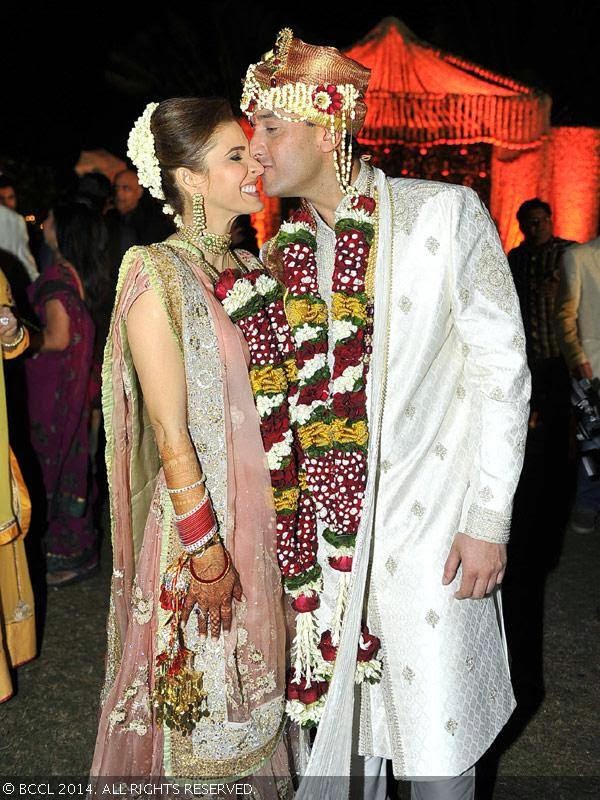 Bridal couple, Raageshwari Loomba and Sudhanshu Swaroop share a tender moment during their wedding, held in Mumbai, on January 27, 2014. 