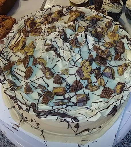 Chocolate cake with peanut butter frosting and  Reese Cup candies.   