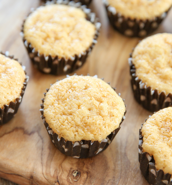 overhead photo of muffins on a wooden board