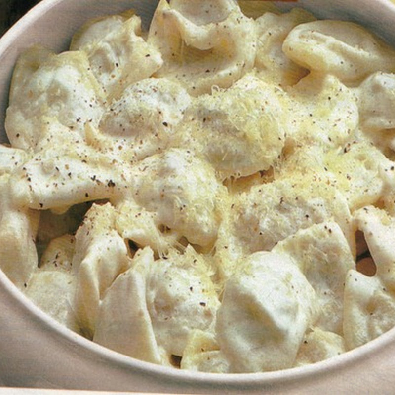 Tortelloni alla boscaiola con funghi e salsiccia.