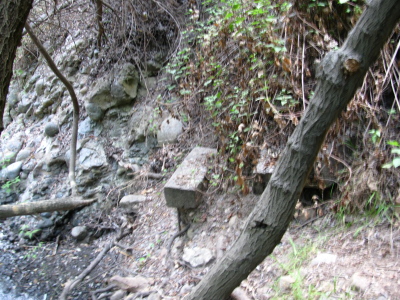 some fairly eroded stairs sticking out of the canyon side