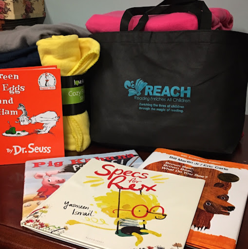 REACH, Inc. (Reading Enriches All Children) logo