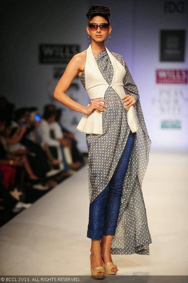 A model showcases a creation by fashion designers Ashish Viral and Vikrant on Day 5 of Wills Lifestyle India Fashion Week (WIFW) Spring/Summer 2014, held in Delhi.