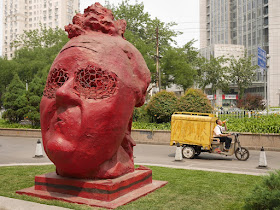 "Red Sculpture" from "Three For You" by Gianni Dessi in front of the Parkview Green in Beijing