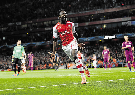 Danny Welbeck celebrates scoring Arsenal's fourth goal and his third during a Uefa Champions League match between the Gunners and Galatasaray at The Emirates Stadium in north London.