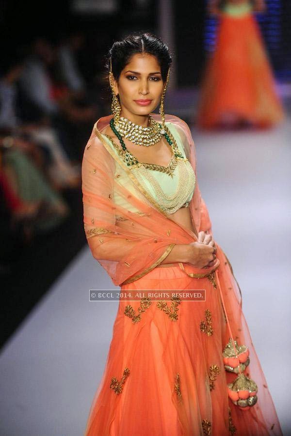 Model showcases a design for  Moni Agarwal on Day 1 of India International Jewellery Week (IIJW), 2014 at Grand Hyatt, Mumbai.