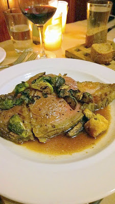 Entree at our Thanksgiving Dinner at the girl & the fig of Slow Roasted Prime Rib with caramelized brussels sprouts, potato gratin and natural jus