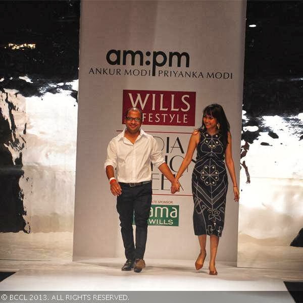 Ankur Modi and Priyanka Modi walk the ramp on Day 2 of Wills Lifestyle India Fashion Week (WIFW) Spring/Summer 2014, held in Delhi.