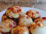 Stuffed Pizza Cupcakes was pinched from <a href="http://pennywisecook.com/stuffed-pizza-cupcakes/" target="_blank">pennywisecook.com.</a>