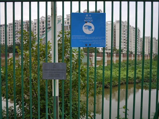 a sign in Macau providing notice of video surveillance at the border with mainland China