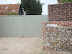 Stone Farm, the location of the Blaxhall Stone, concealed behind fence, wall and gates