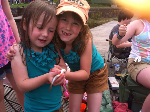 Poppy with her first fish being held by Annie!!