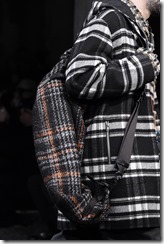 MILAN, ITALY - JANUARY 13:  A model, detail, walks the runway at the Marni show during Milan Men's Fashion Week Fall/Winter 2018/19 on January 13, 2018 in Milan, Italy.  (Photo by Pietro D'Aprano/Getty Images for Marni)