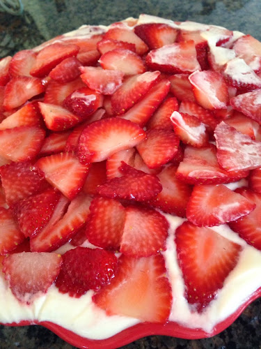 Brownie topped with pudding and berries