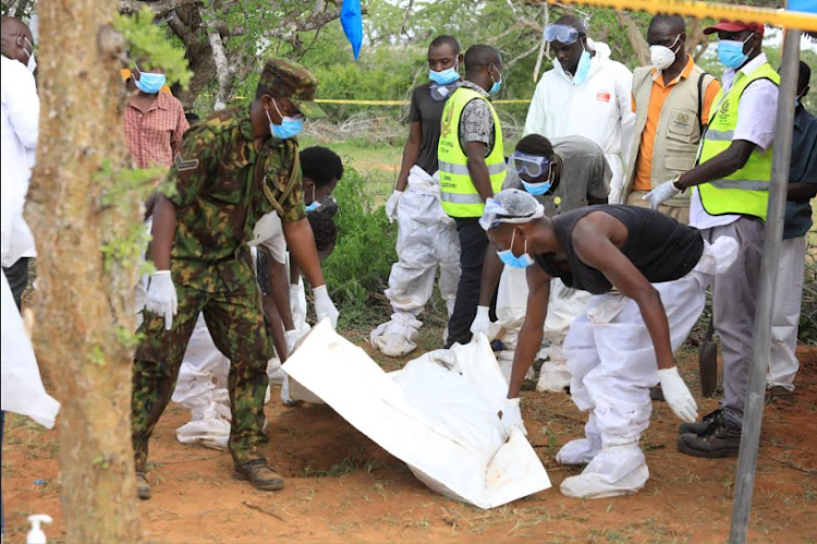 Homicide and forensic experts retrieve bodies of people believed to be followers of Malindi pastor Paul Mackenzie in Shakahola in Magarini constituency in Kilifi county