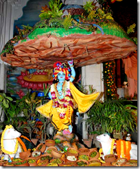 [Krishna lifting Govardhana Hill]