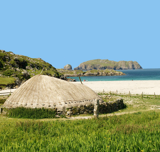 Closeup of a re-creation of a thatched house from the Iron Age House at Bosta Beach in Great Bernera in the western islands of Scotland. 