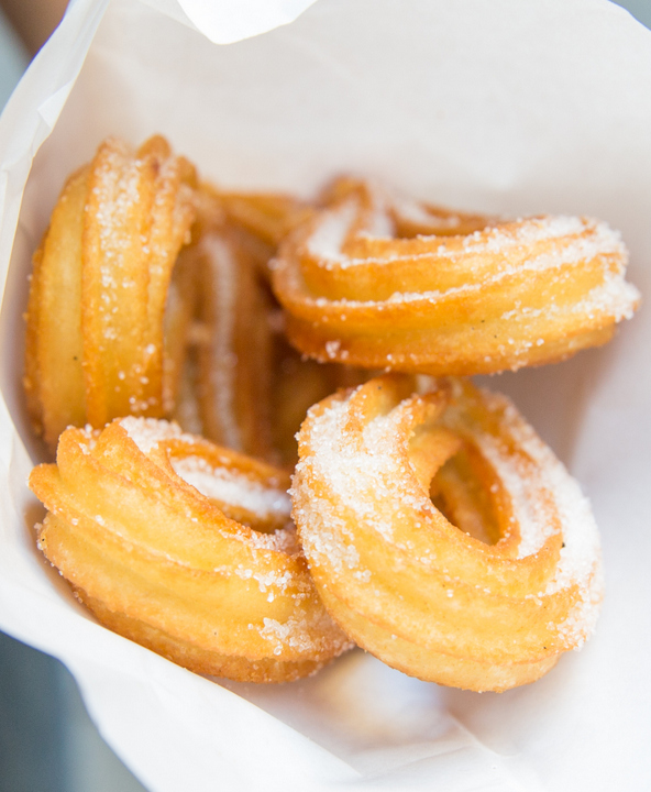 overhead photo of churros wrapped in paper