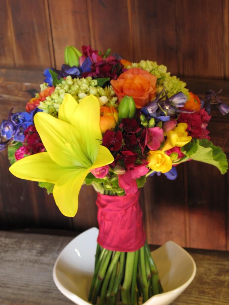 orange ranunculus, roses,