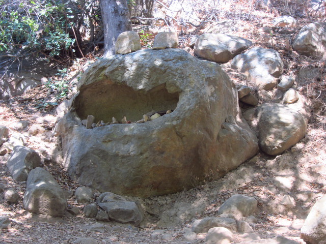 rocks set in an eroded bit of sandstone as teeth in a mouth