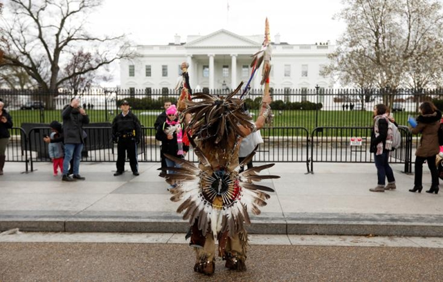 A Native American demonstrator says a prayer in front of the White House, 11 March 2017. Photo: White Wolf Pack